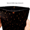 Hands holding a pouch with a snap closure to protect Kindle e-readers made with black with gold metallic stars fabric.